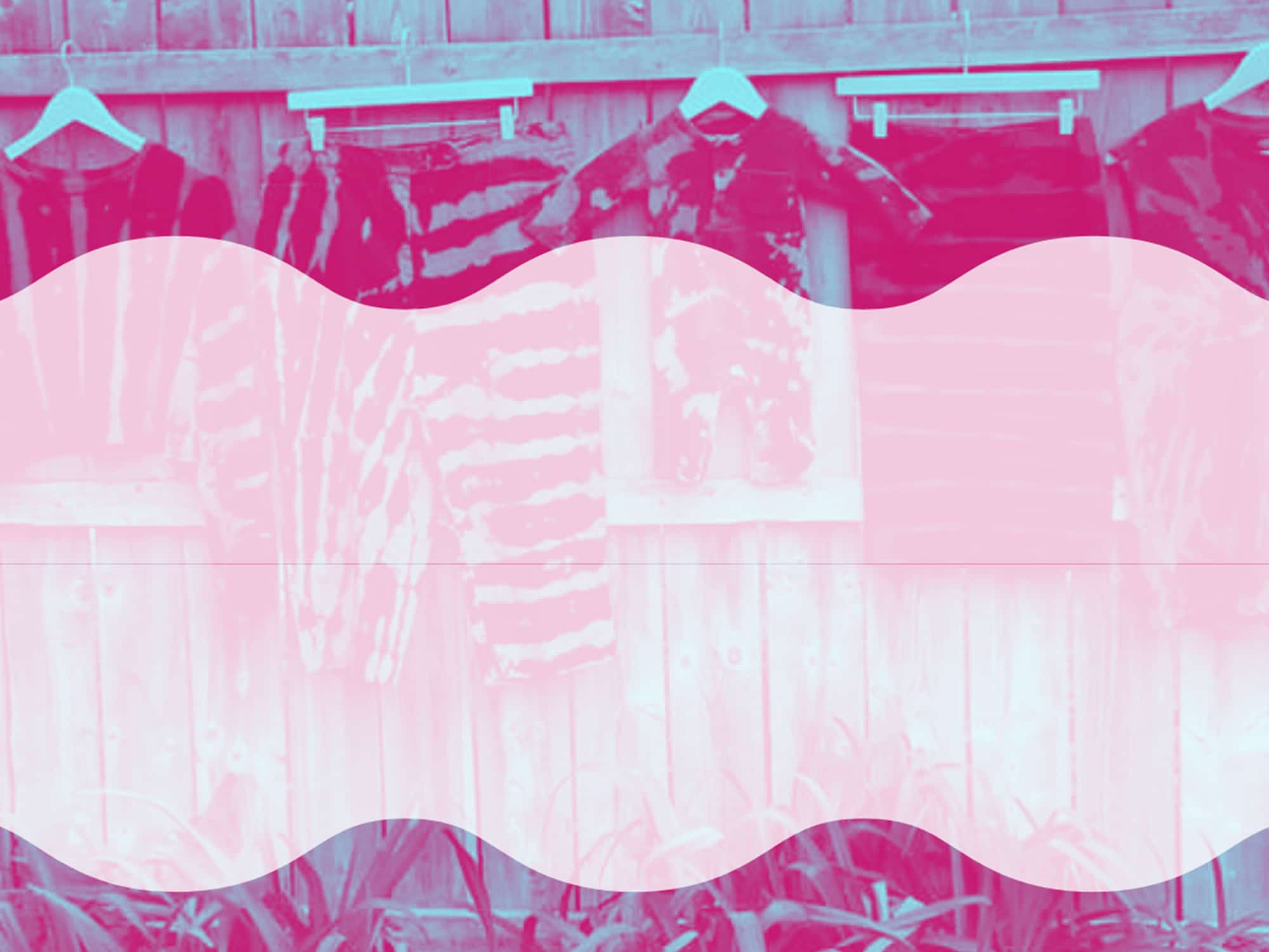 A photo-illustration shows assorted tie-dyed clothing items hanging along a wooden fence. A wavy pink shape runs laterally across the image.
