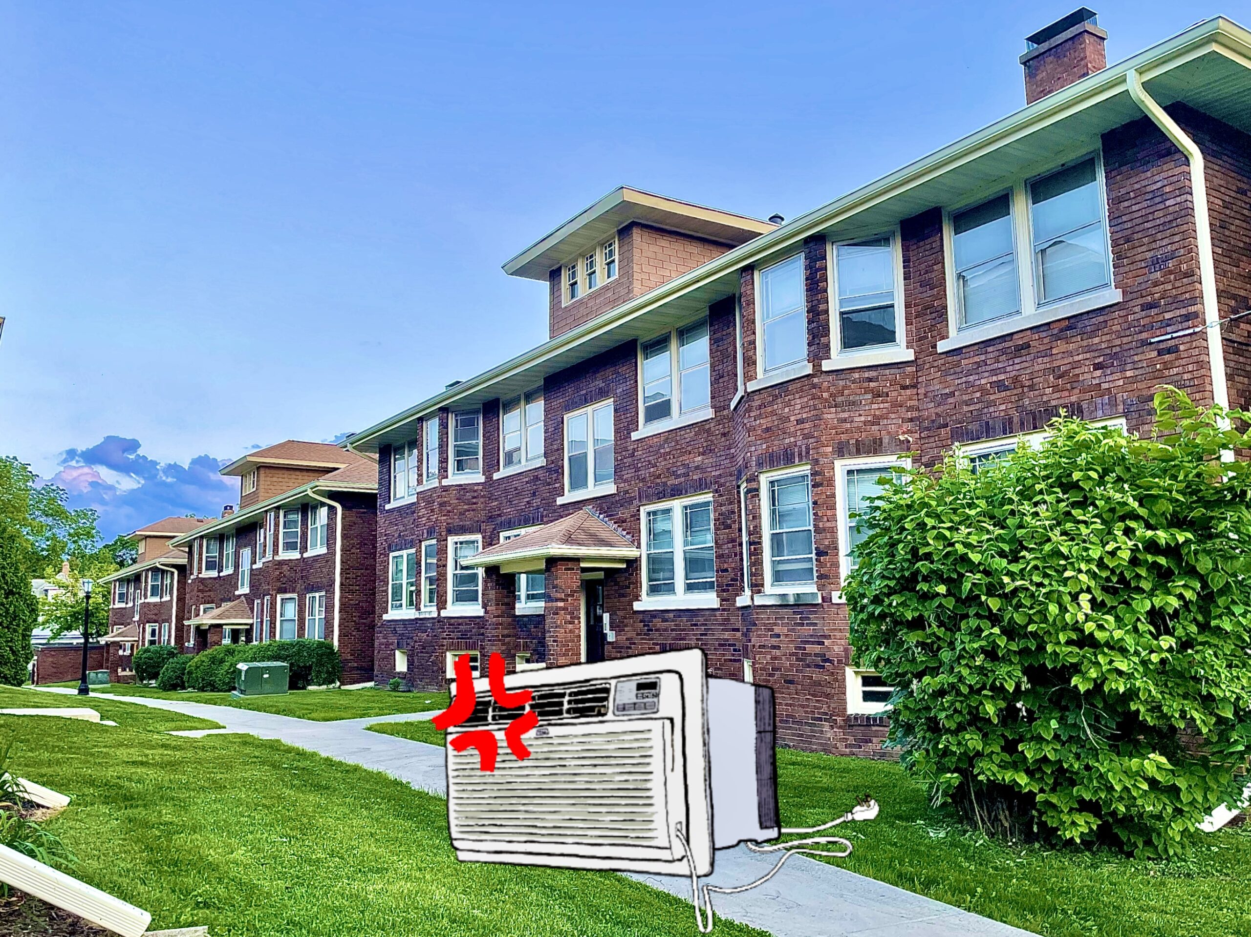 Picture of Norris Court Apartments with an angry window AC unit sitting on the lawn.