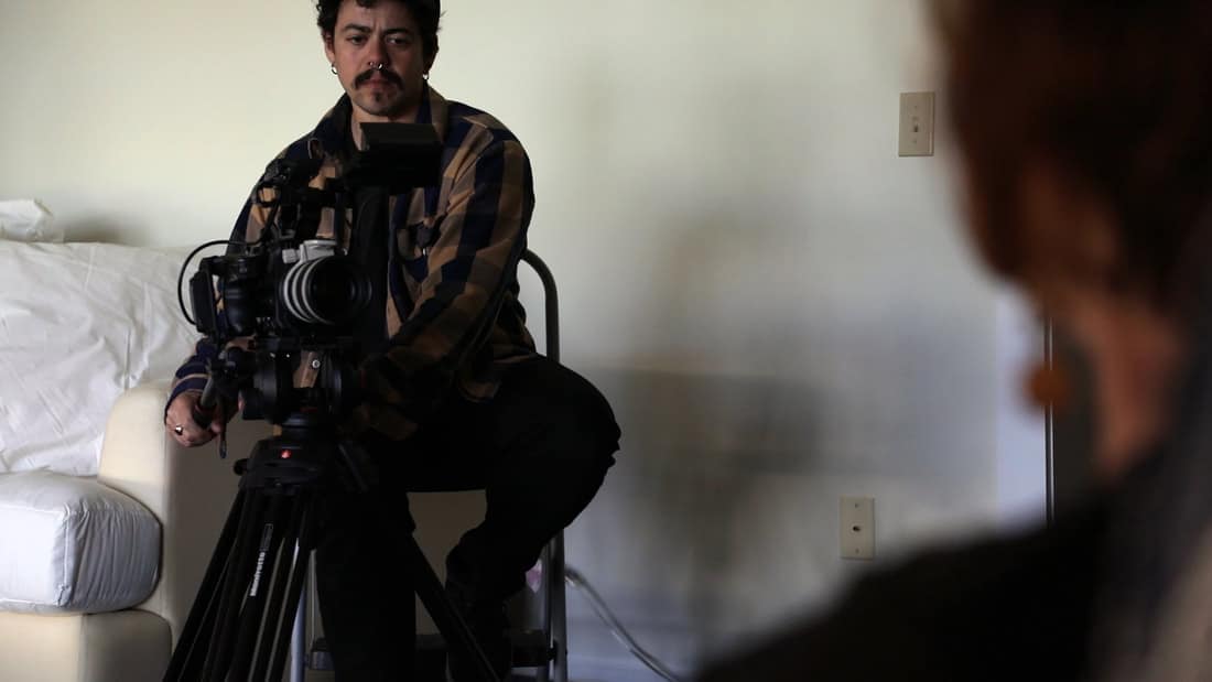 Angelo Madsen Minax carefully films and interviews a subject in "North By Current."