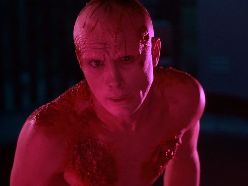 Actor Jeffrey Combs is shown in a mutated, glowing-pink form in the film From Beyond.