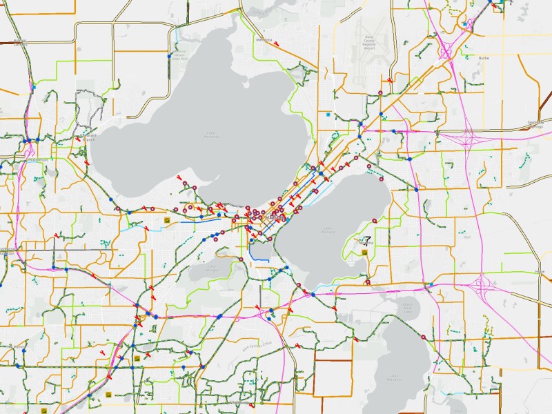 An overhead map of Madison shows the city's bike paths with bright colors.