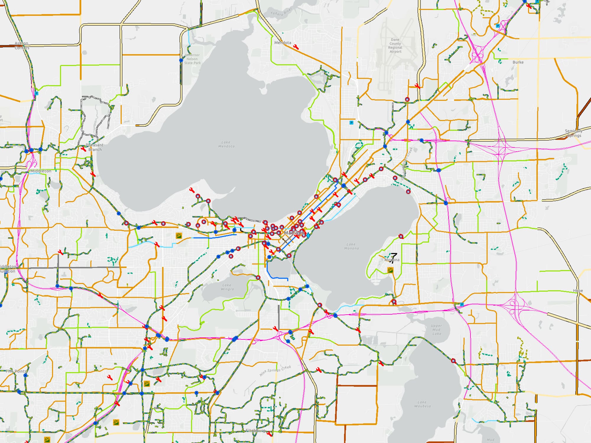An overhead map of Madison shows the city's bike paths with bright colors.