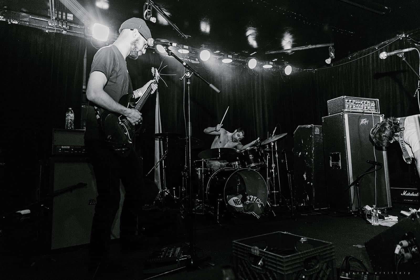 A black-and-white photo of The Central performing live.