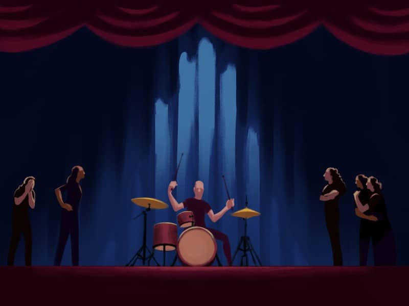 An illustration shows a nondescript man actively drumming in the center of a stage with a blue backdrop and red curtains above. Five women stand on both sides of the stage to the drummer's left and right, surrounding him. The women convey negative, upset emotions through their arm gestures and body language.