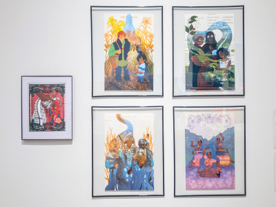Five printed digital illustrations hang from a gallery wall. The four larger illustrations hanging as a quadrant to the right of center explore themes of water, while the singular piece on the left shows handing embracing holding a keffiyeh and kokum scarf.