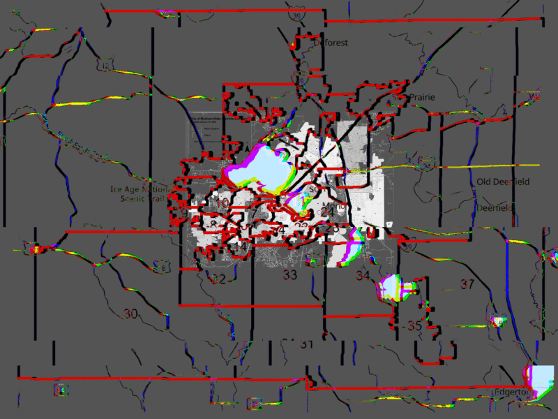 A partly distorted map of Dane County districts that are numbered and named as well as primarily designated by squiggly red and black lines. A background image filter is a dark grey color that obscures many of the district numbers, towns, cities, and route names.