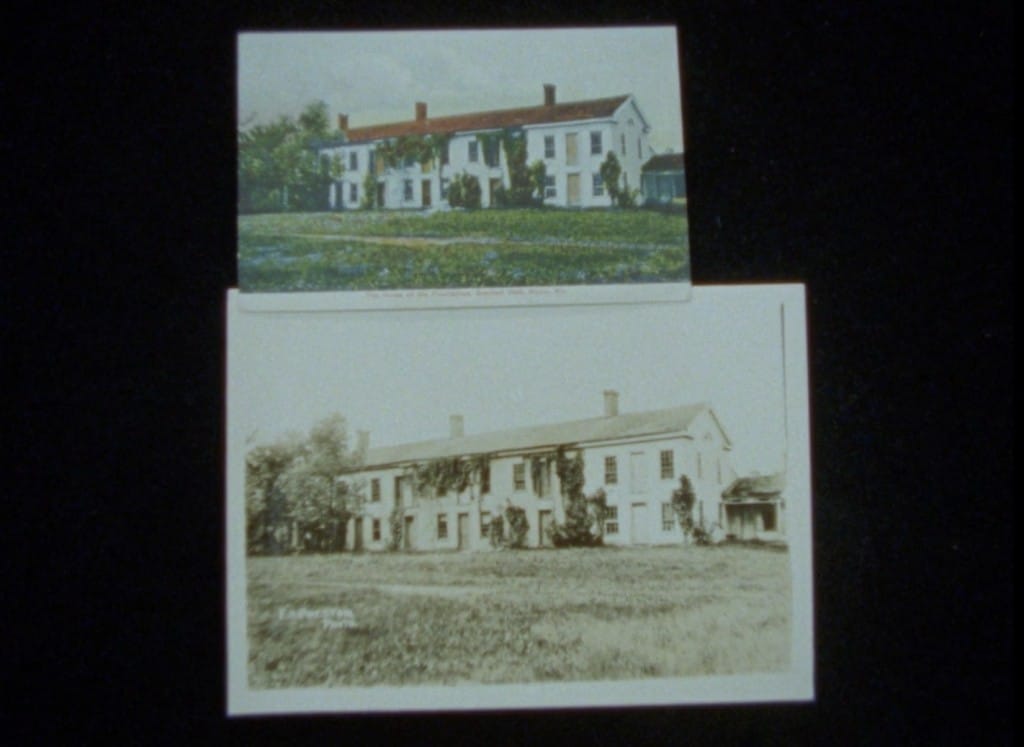 Still frame taken from the experimental documentary "The Phalanx" shows two faded photos of the agrarian commune longhouse in Ripon, Wisconsin. The smaller one at the top is in color, while the larger one at the bottom is in black and white.